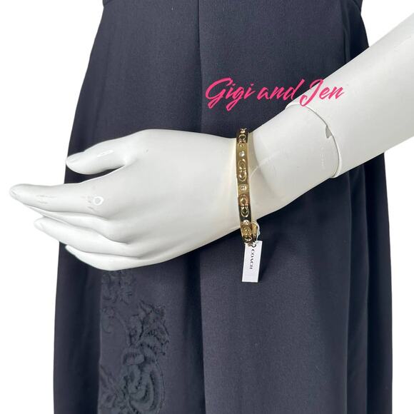 Coach Gold tone Kissing C Hinged Bangle Bracelet - Picture 2 of 9